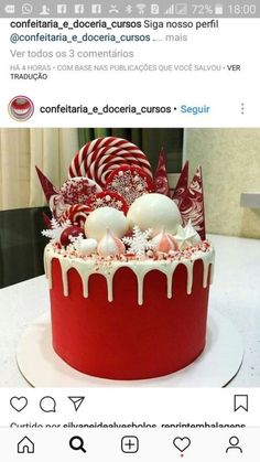 a red and white cake sitting on top of a table next to candy canes