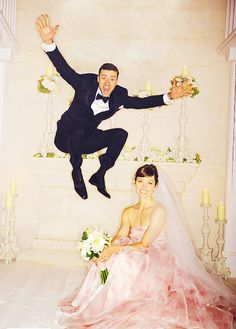 a bride and groom posing for a wedding photo