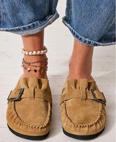 Details

Style No. 81224263; Color Code: 111

So effortless for a laid back look, these hand-stitched mules feature soft suede uppers with a moccasin-inspired construction and a buckle detail.

Features: Slip-on style, backless design, suede uppers, hand-stitched mocc stitching, round toe, buckle detail, lined footbed, rubber outsole

Why We <3 It: Made with great care and love, the mocc seam stitch is hand-stitched and each pair is hand-lasted, making the shape and execution vary with hand-touched charm.

FP Collection

Artisan crafted from fine leathers and premium materials, FP Collection shoes, bags and belts are coveted for their signature vintage Black Mules Outfit, Ladies Footwear, Suede Mules, Backless Design, Walk This Way, Layered Jewelry, Vintage Aesthetic, Soft Suede, Boho Clothing