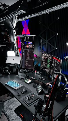 a computer desk topped with two monitors and a keyboard