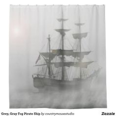 a shower curtain with a ship in the fog