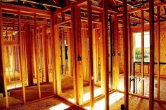 the interior of a house being built with wooden framing