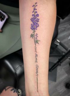 a woman's foot with a purple flower on it and the words, i love you