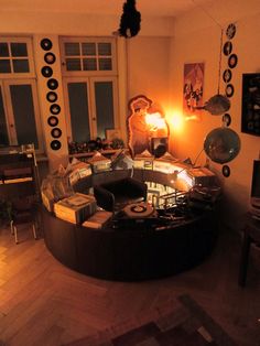 a living room filled with furniture and lots of clutter on top of the floor