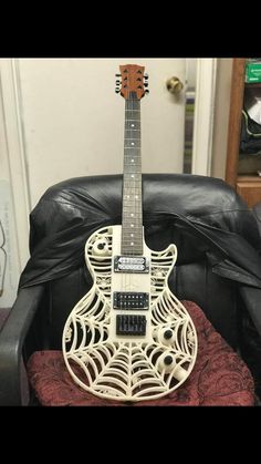 an electric guitar sitting on top of a chair