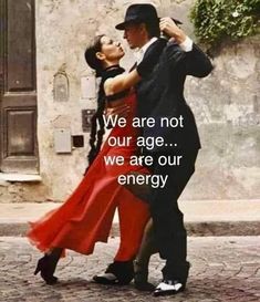 a man and woman dancing on the street with an inspirational quote about love for each other