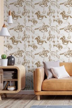 a living room scene with focus on the couch and wallpaper that has an animal design