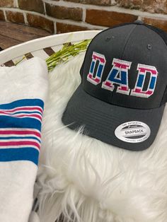 **Dad, Mom, Pop Embroidered Hat - Swaddle Hospital Blanket Keepsake Custom Hat** Cherish the precious memories of your little one's first moments with our custom embroidered hat, made from hospital swaddle blankets we carry in stock. These unique hats are not only a stylish accessory but also a heartfelt keepsake, perfect for celebrating the special bond between parent and child. **Features - **Customized Embroidery Personalize your hat with up to 3 letters. Choose from "Dad," "Mom," or "Pop" to make it uniquely yours. - **Sentimental Keepsake A beautiful way to preserve the memory of your baby's birth, making it a treasured family heirloom. - **Perfect Gift Ideal for new parents, baby showers, or as a thoughtful present for grandparents. **Product Details - **Material hospital swaddle bla Mom Embroidery Ideas, Baby Clothes Keepsake Ideas, Baby Boy Diy Gifts, Hospital Blanket Keepsake, Matching Mommy Son Outfits, Gifts For Dad From Baby, Hospital Swaddle, Embroidery Outfits, New Dad Gifts