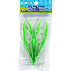 two green toothbrushes in plastic packaging on white background, one is for perler