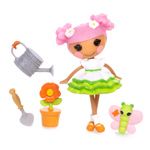 a doll is standing in the grass with flowers and gardening tools next to some plants