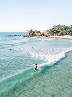 a person riding a surfboard on a wave in the ocean