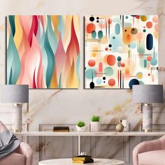 two paintings on the wall in a living room with pink chairs and a coffee table