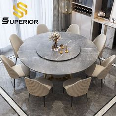 a round table with chairs around it and the logo superior on the wall in the background