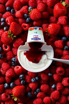 yogurt and berries spread out on top of each other