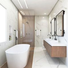 a bathroom with a large bathtub next to two sinks