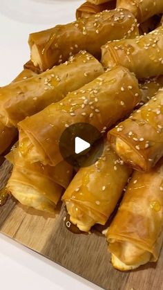 some food is sitting on a cutting board and ready to be eaten with sesame seeds