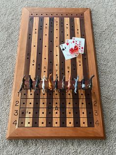 a game board with several pieces of playing cards on it