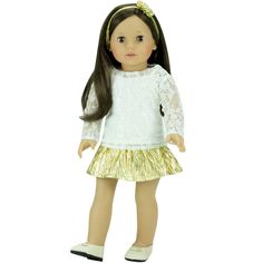 a doll with long hair wearing a white shirt and gold skirt, standing on a white background