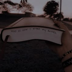 someone holding up a book with the words this is how i think my battles written on it