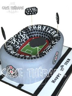 a cake that is shaped like a baseball field