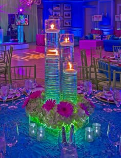 the centerpiece is decorated with candles and flowers