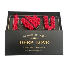 a box with roses in the shape of a heart and words deep love written on it