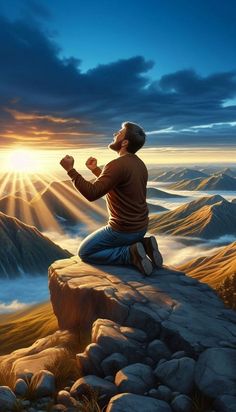 a man sitting on top of a mountain while praying