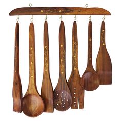 wooden spoons and spatulas hanging from hooks