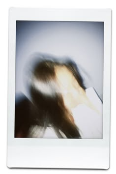 a blurry photo of a woman with long hair