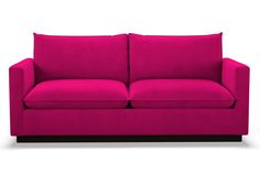 a fuchsia colored couch with wooden legs