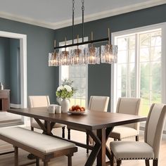 a dining room table with chairs and a bench