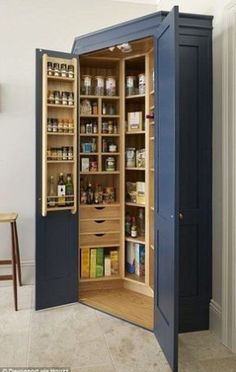 an open pantry in the corner of a room