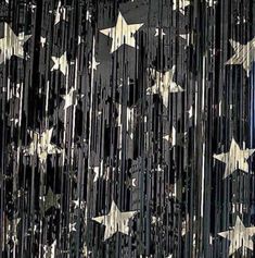 an american flag made out of stars is shown in black and gold foiled paper