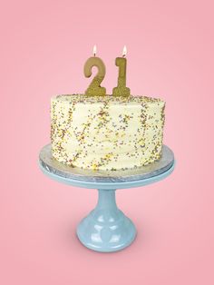 a birthday cake with the number twenty two candles on it and sprinkles