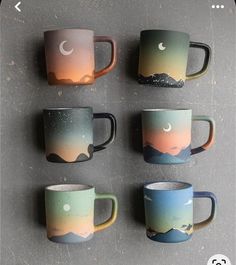 six coffee cups with mountains and stars painted on them