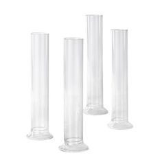 three tall clear vases sitting next to each other on top of a white surface