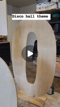 a large wooden letter sitting on top of a table