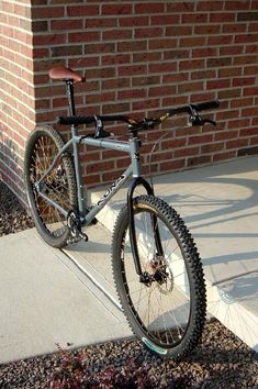 a bike parked in front of a brick building