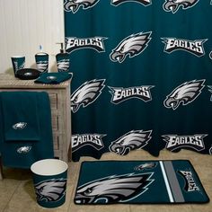 the philadelphia eagles shower curtain and rug are on display in front of a bathroom sink