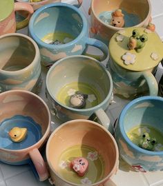 there are many cups that have animals in them