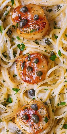 pasta with shrimp and olives in a white sauce