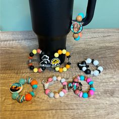 a coffee cup and some beads on a table