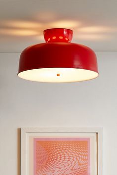 a red light hanging from the ceiling in a room