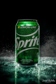 a can of sprite on a wet surface