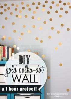 gold polka dot wall decals on a dresser in a room with bookshelves