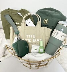 a basket filled with personal items on top of a bed