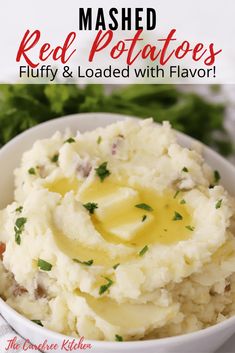 mashed red potatoes in a white bowl with butter and parsley on the side