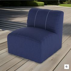 a blue chair sitting on top of a wooden floor