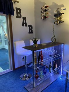 a bar with several bottles and glasses on it