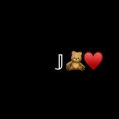 a brown teddy bear sitting next to a red heart on a black background with the word i love u